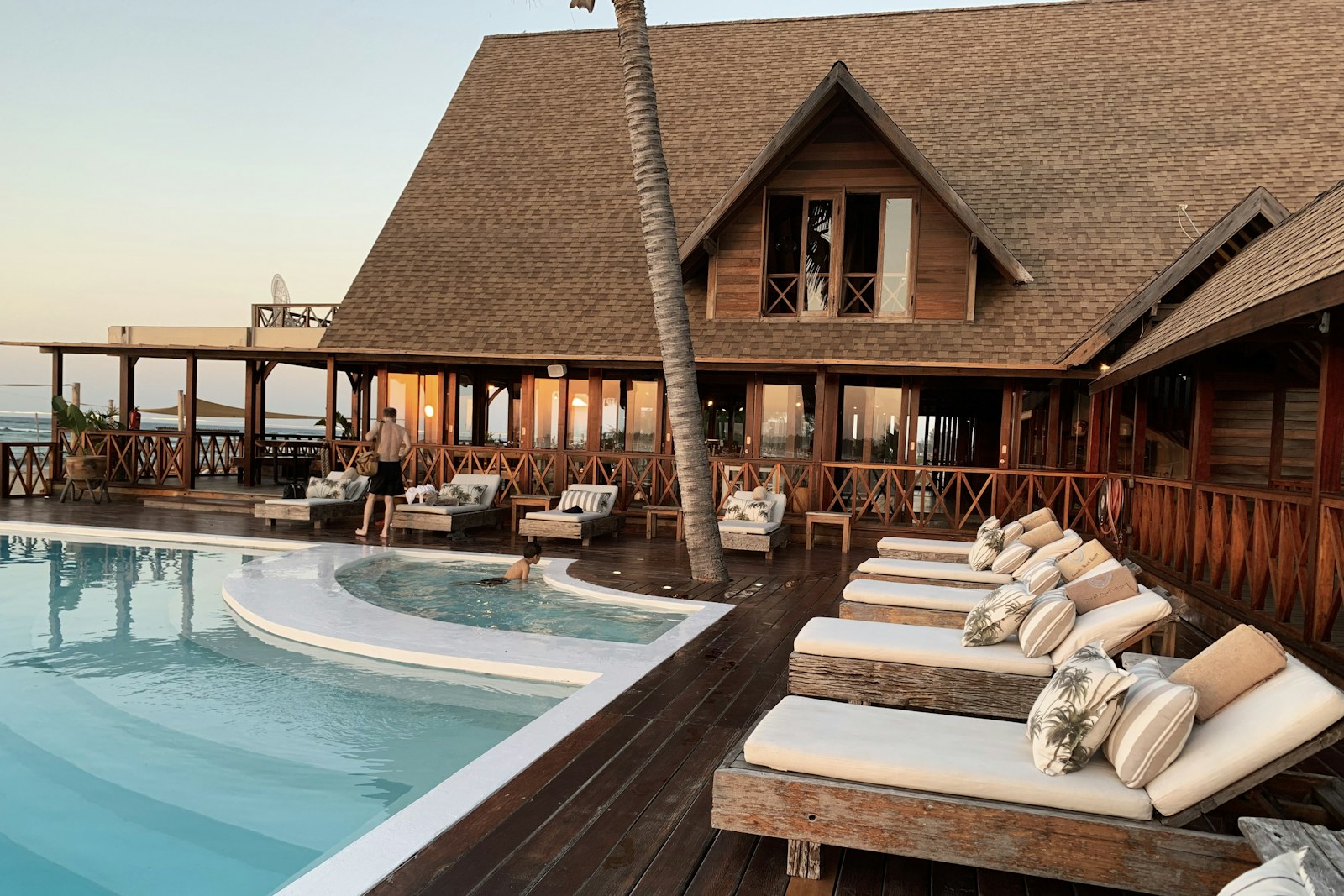 Luxury hotel pool and pavilion at dusk